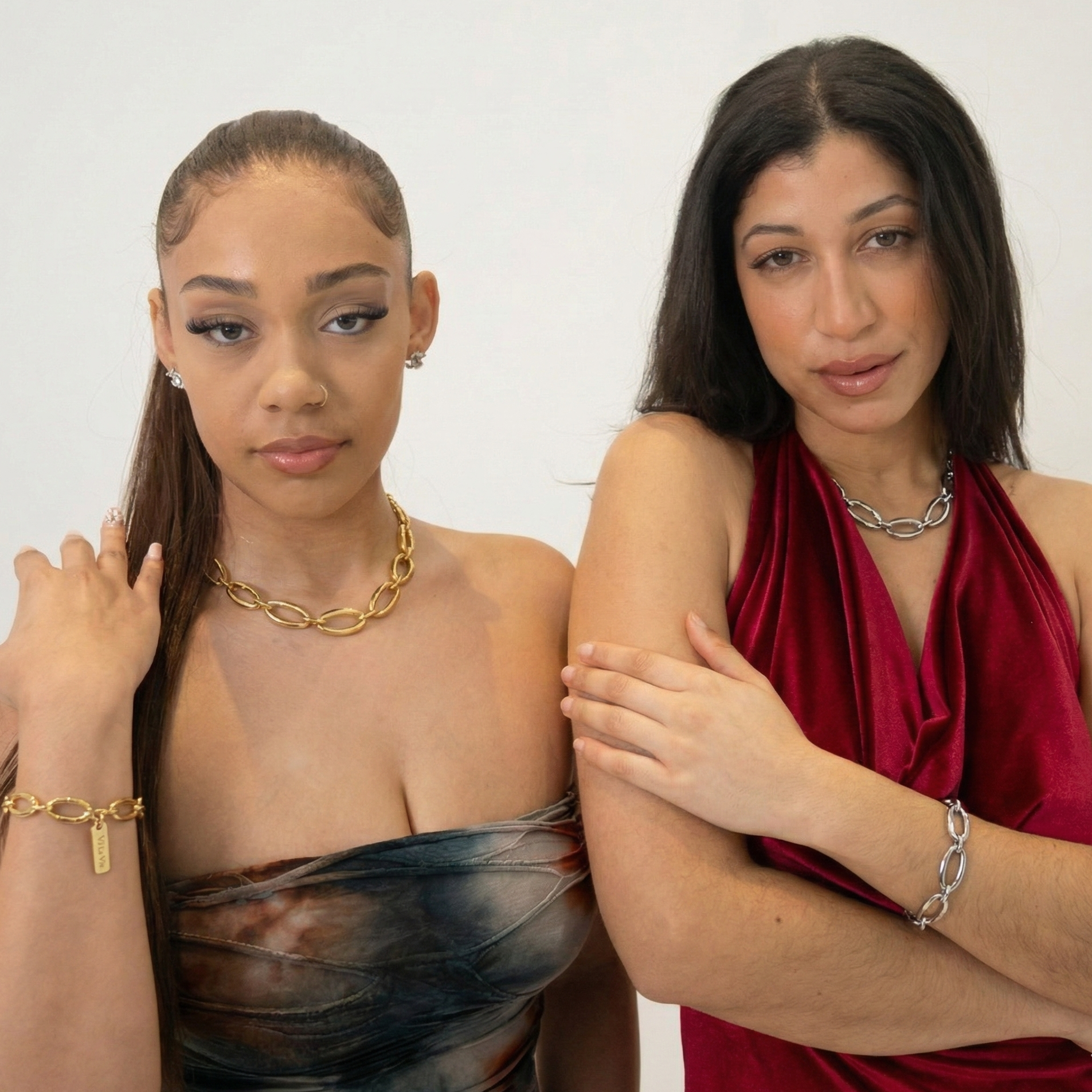 2 women wearing jewelry