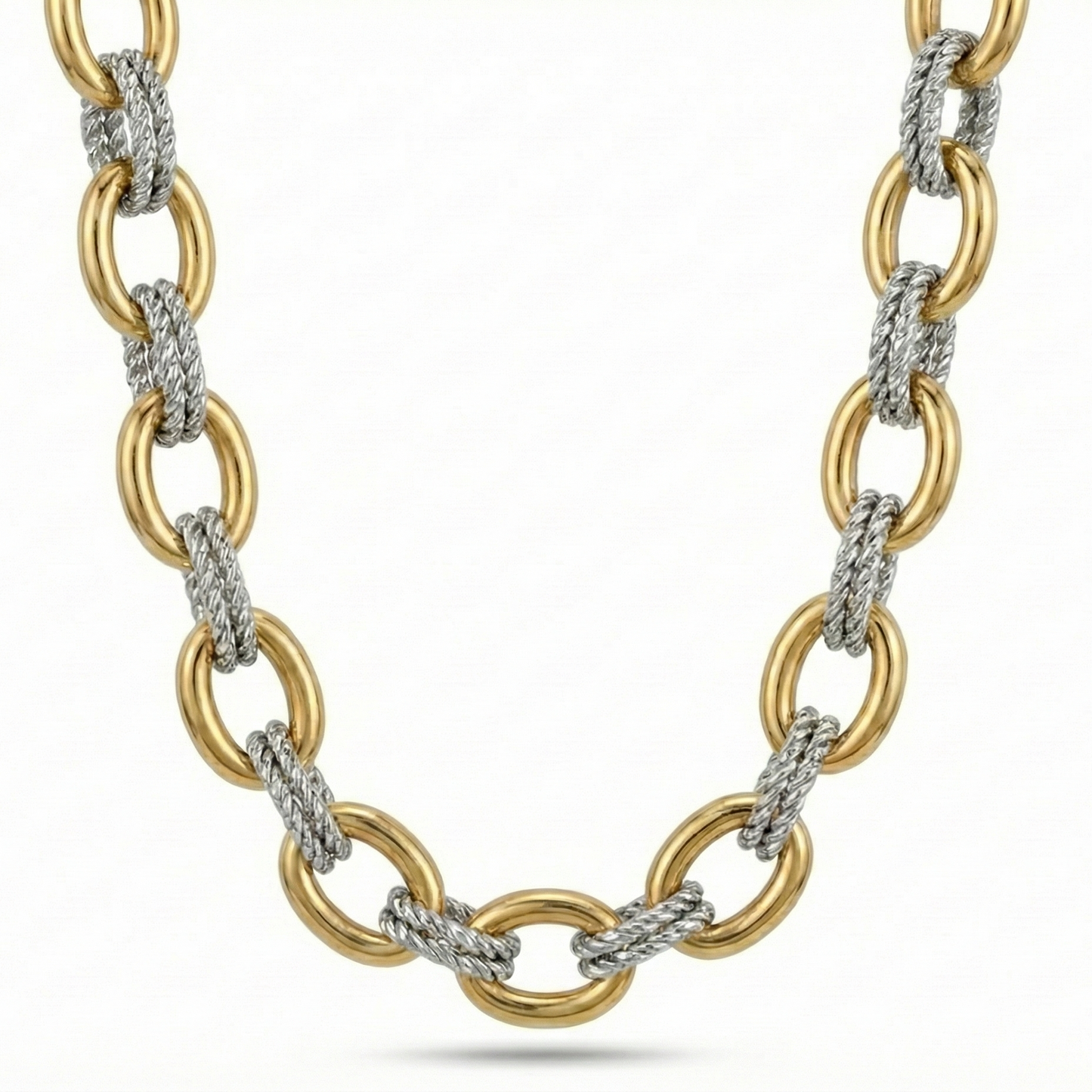 Gold and silver chain necklace on a white background
