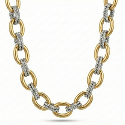 Gold and silver chain necklace on a white background