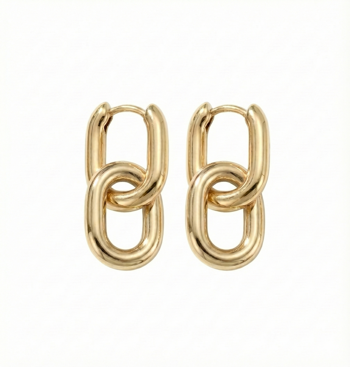 Pair of gold chain link earrings on a white background