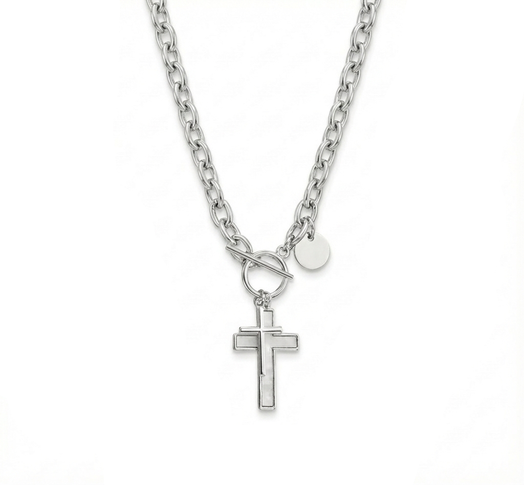 Silver necklace with a cross pendant on a white background